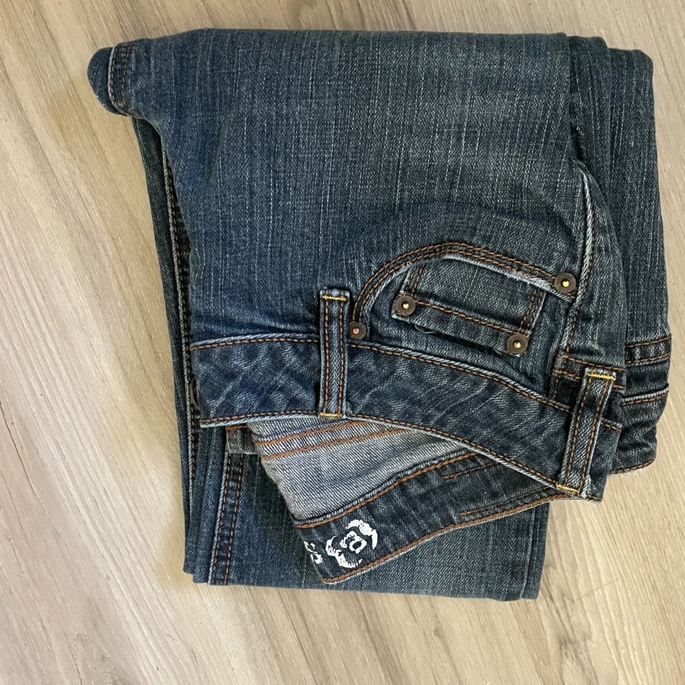 2 pairs of size 1 jeans